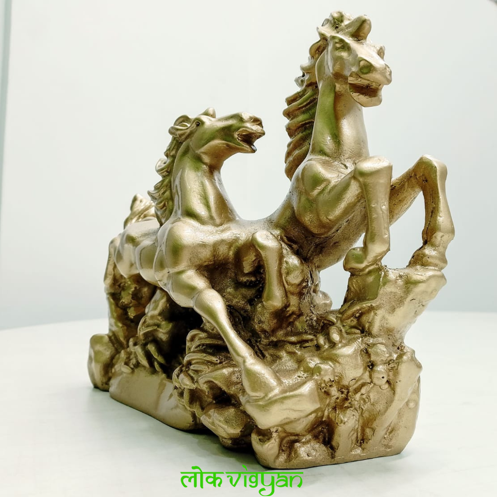 Gold statue of galloping horses